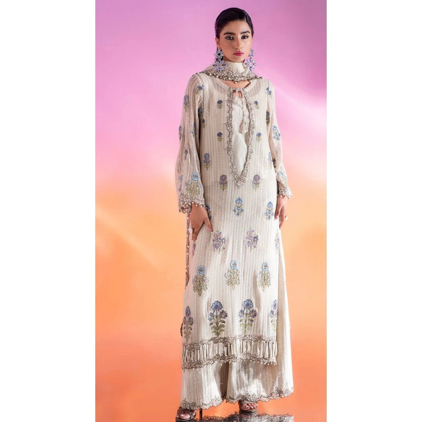 Luxury Embroidered Chiffon Suit – Features an embroidered chiffon shirt with adda and patch work, raw silk blouse and trousers, and an organza dupatta with lace detailing.