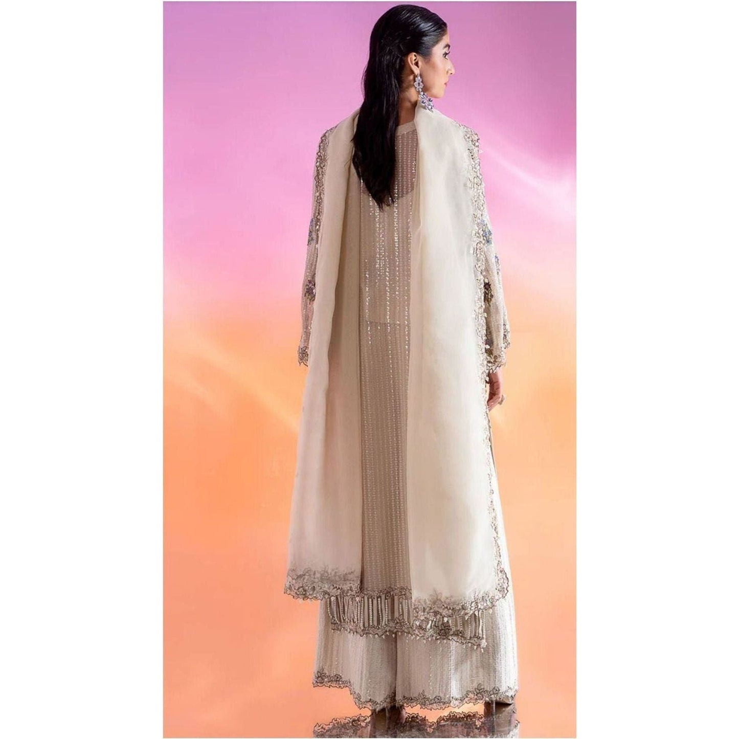 Luxury Embroidered Chiffon Suit – Features an embroidered chiffon shirt with adda and patch work, raw silk blouse and trousers, and an organza dupatta with lace detailing.