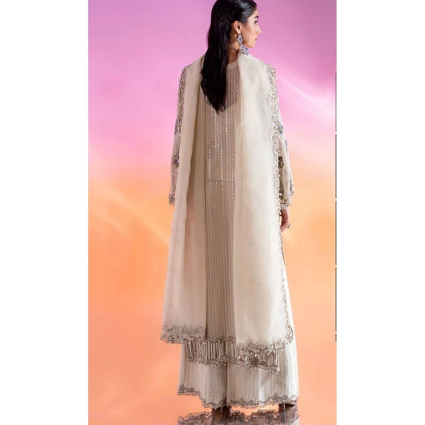 Luxury Embroidered Chiffon Suit – Features an embroidered chiffon shirt with adda and patch work, raw silk blouse and trousers, and an organza dupatta with lace detailing.