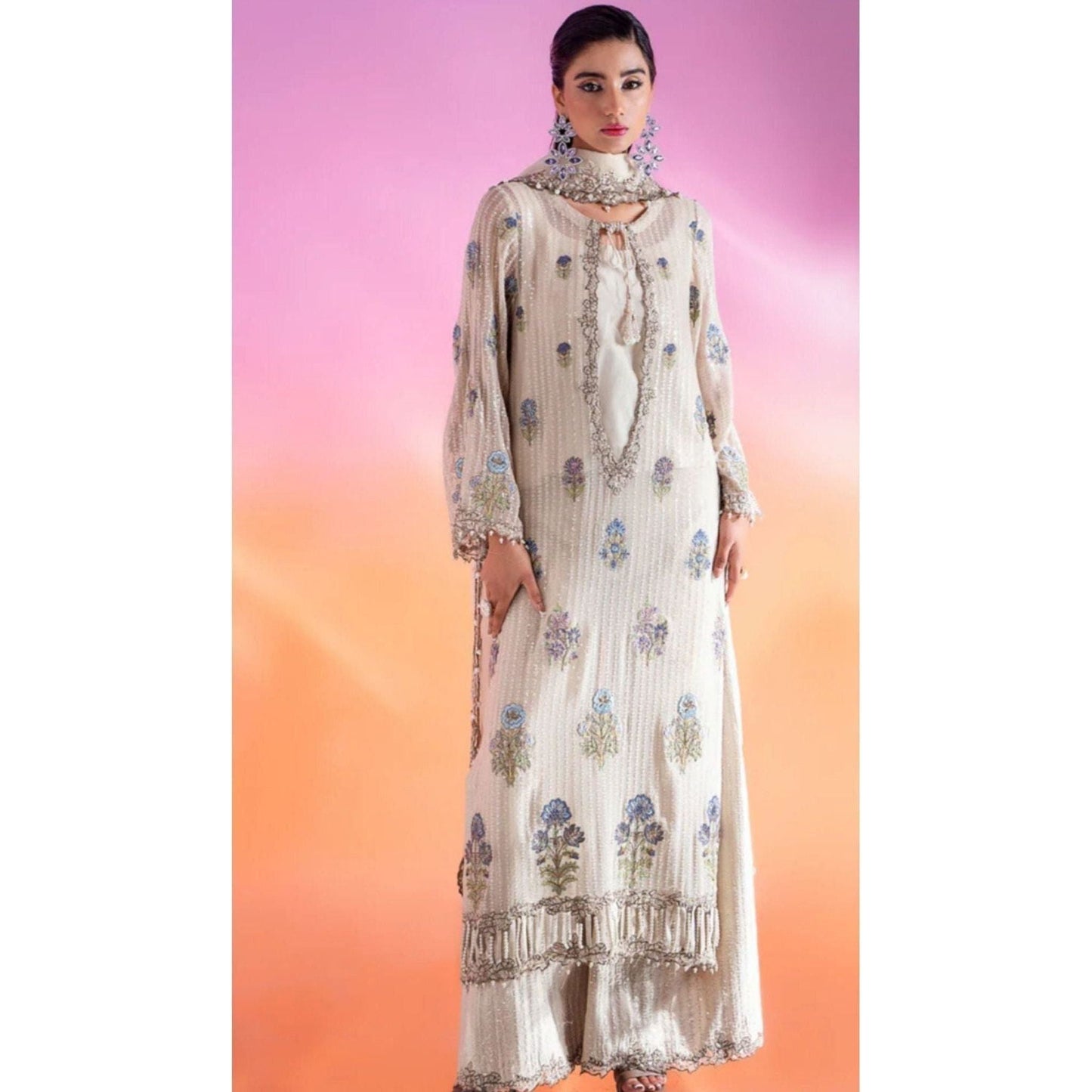Luxury Embroidered Chiffon Suit – Features an embroidered chiffon shirt with adda and patch work, raw silk blouse and trousers, and an organza dupatta with lace detailing.