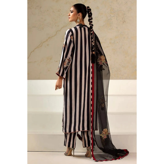 Luxury Raw Silk Printed Suit – Embroidered front and sleeves, organza dupatta with motifs, and stitched raw silk trouser for an elegant look.
