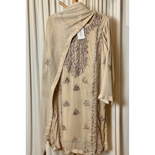 A chiffon fabric off white outfit with hand embroidery. by Najmadesigns and co. gotta work