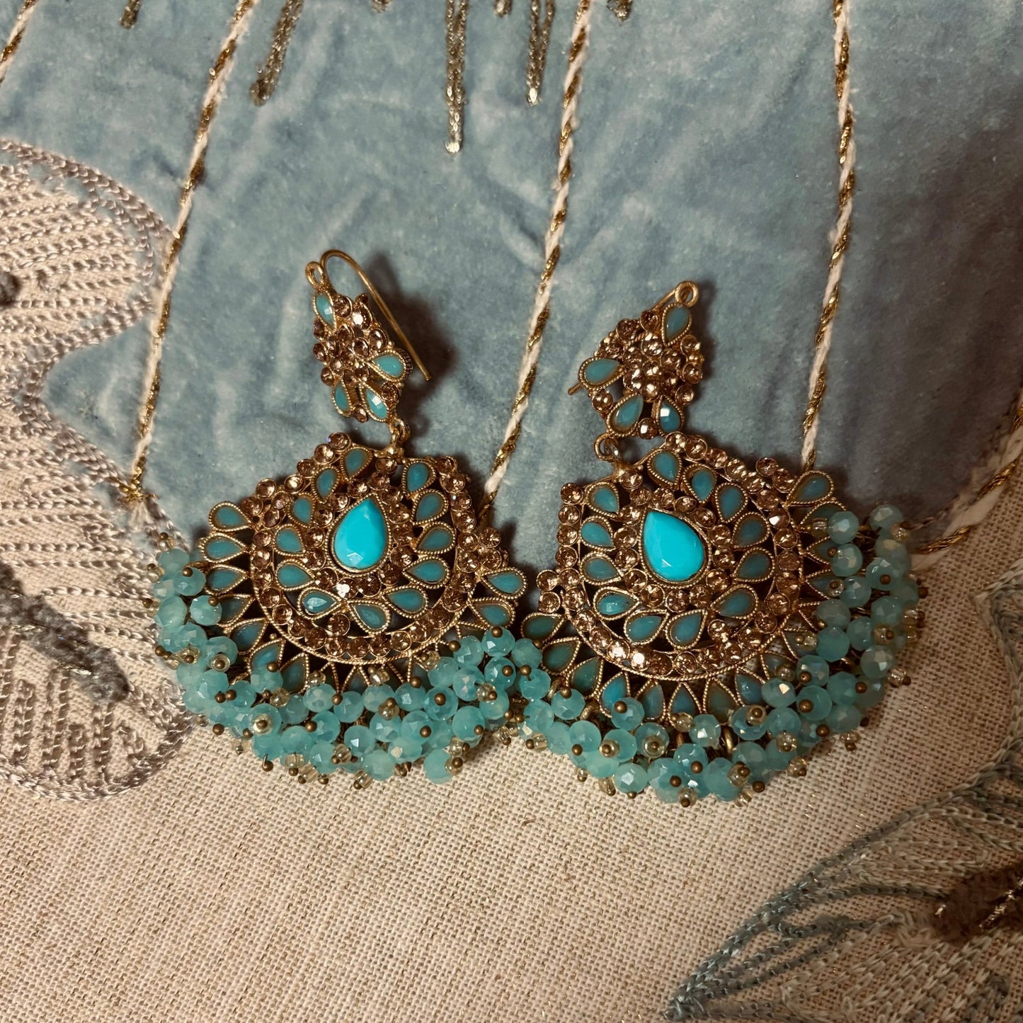 • Clothing: Embroidered/Printed suit for women - Made of best quality fabric - lawn or linen or chiffon - pure silk - Available at Najma Designs & Co. • Jewelry: Gold - plated stud earrings for