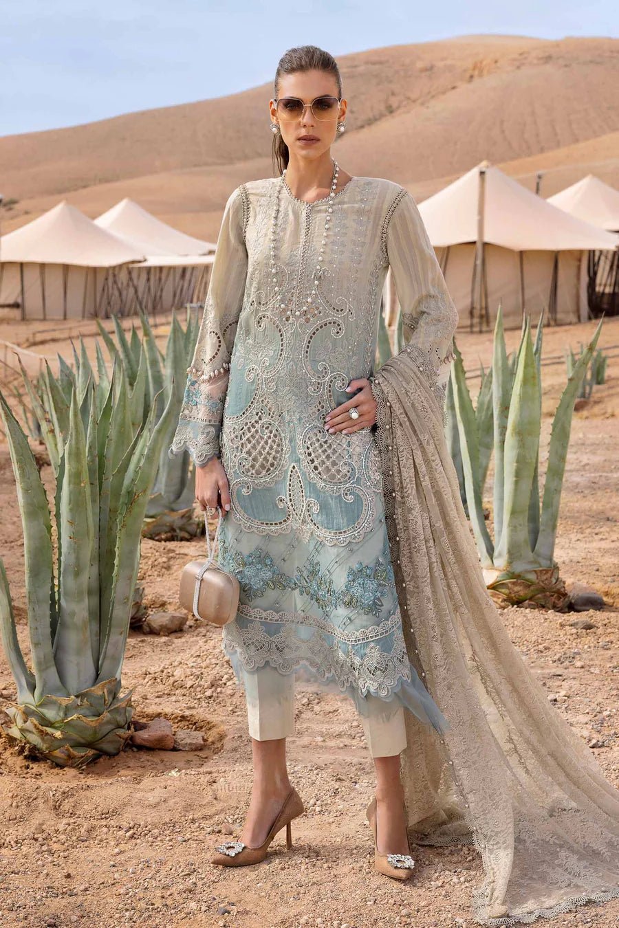 • Clothing: Embroidered/Printed suit for women - Made of best quality fabric - lawn or linen or chiffon - pure silk - Available at Najma Designs & Co. • Jewelry: Gold - plated stud earrings for