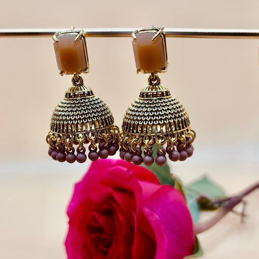 • Clothing: Embroidered/Printed suit for women - Made of best quality fabric - lawn or linen or chiffon - pure silk - Available at Najma Designs & Co. • Jewelry: Gold - plated stud earrings for