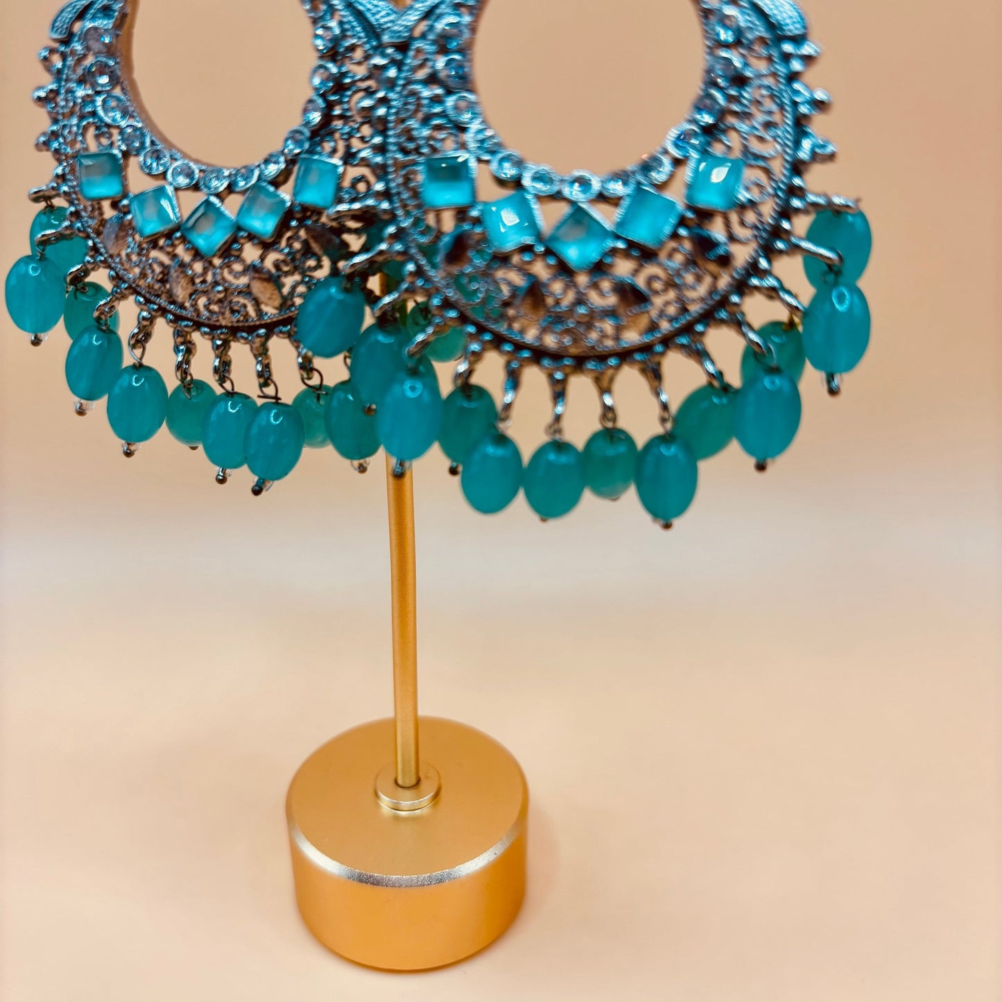 • Clothing: Embroidered/Printed suit for women - Made of best quality fabric - lawn or linen or chiffon - pure silk - Available at Najma Designs & Co. • Jewelry: Gold - plated stud earrings for