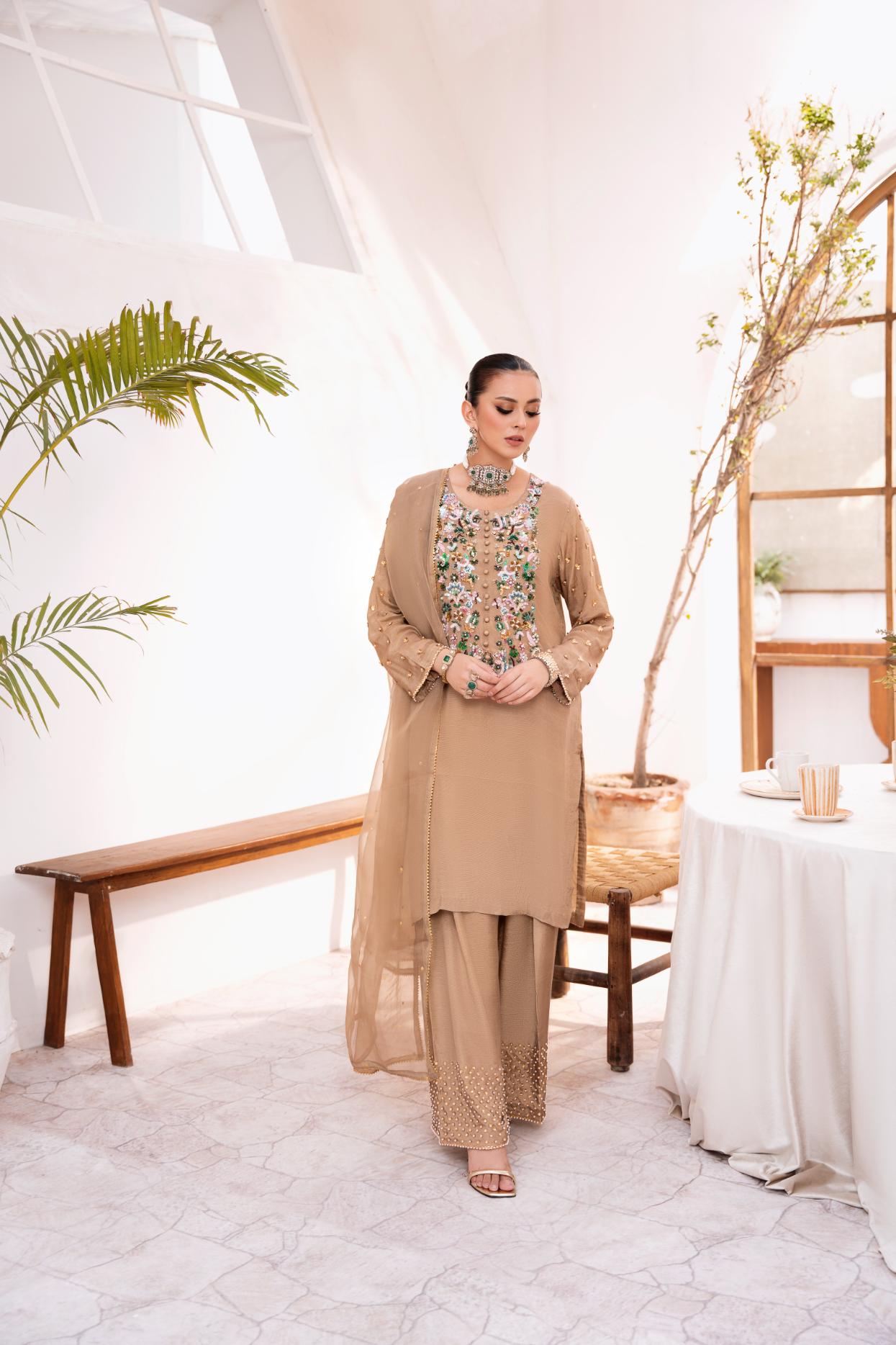 • Clothing: Embroidered/Printed suit for women - Made of best quality fabric - lawn or linen or chiffon - pure silk - Available at Najma Designs & Co. • Jewelry: Gold - plated stud earrings for