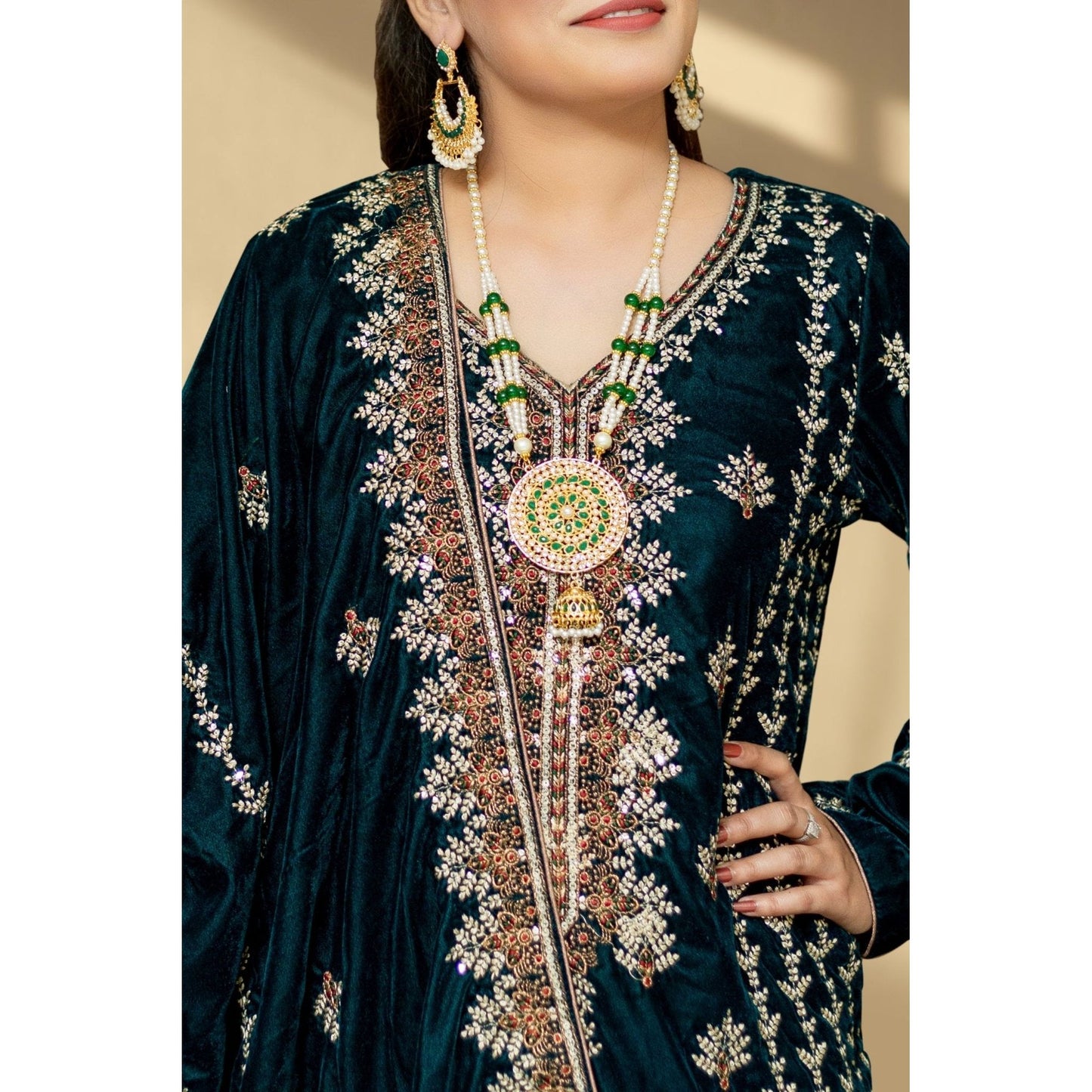 The Sea Green Velvet Luxury 3-piece Suit includes a velvet embroidered shawl. The model is wearing a large size.