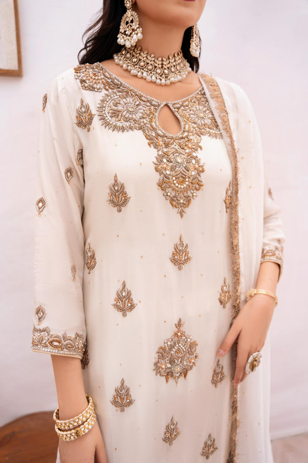 • Clothing: Embroidered/Printed suit for women - Made of best quality fabric - lawn or linen or chiffon - pure silk - Available at Najma Designs & Co. • Jewelry: Gold - plated stud earrings for