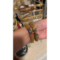 • Clothing: Embroidered/Printed suit for women - Made of best quality fabric - lawn or linen or chiffon - pure silk - Available at Najma Designs & Co. • Jewelry: Gold - plated stud earrings for