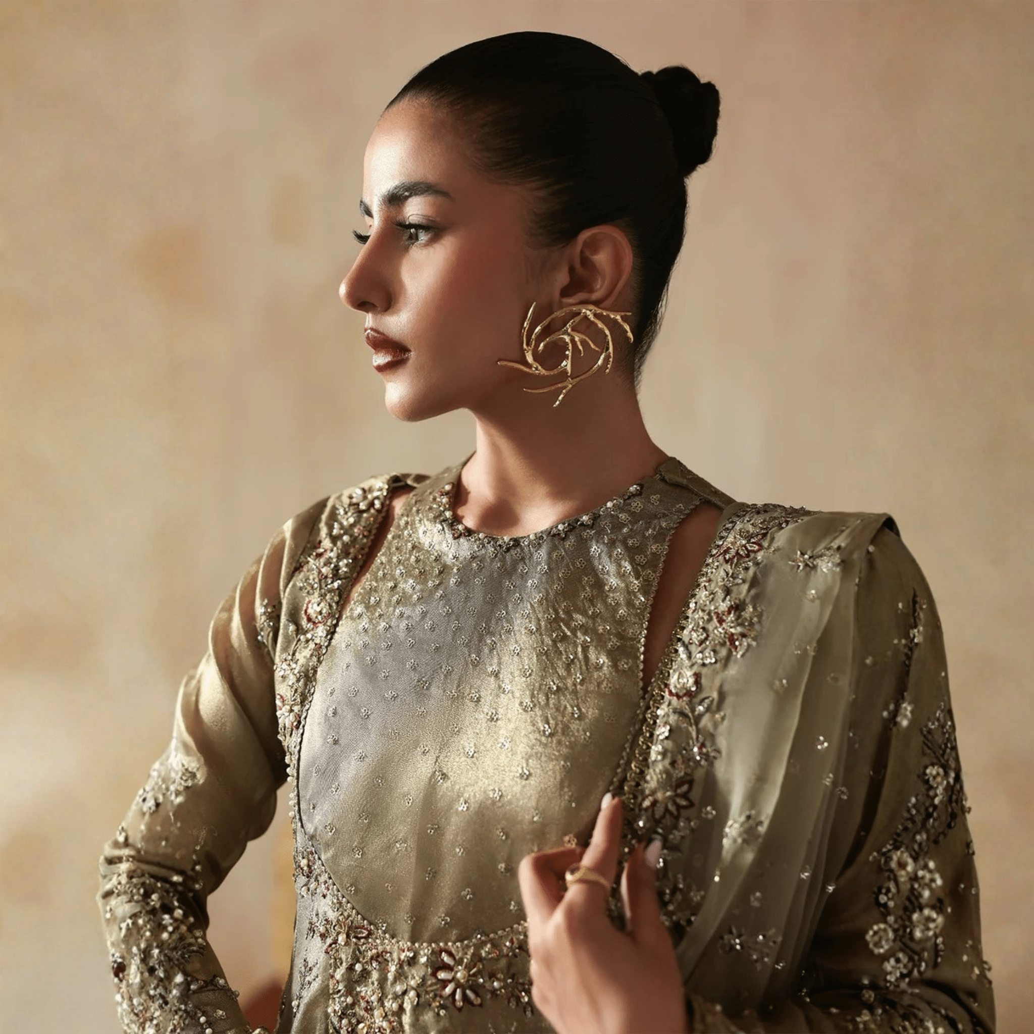 • Clothing: Embroidered/Printed suit for women - Made of best quality fabric - lawn or linen or chiffon - pure silk - Available at Najma Designs & Co. • Jewelry: Gold - plated stud earrings for