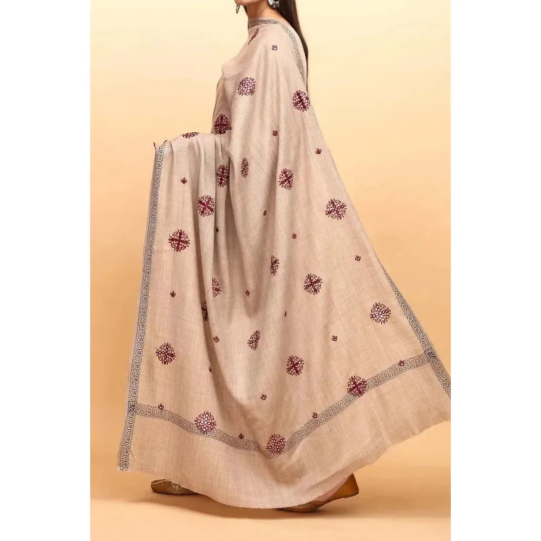 A beautiful light gray brown shawl with maroon embroidery. It is lightweight and suitable for both casual and formal wear. The brand name is Stylo Pk. It is available for purchase in the United States at Najmadesighns and Co.