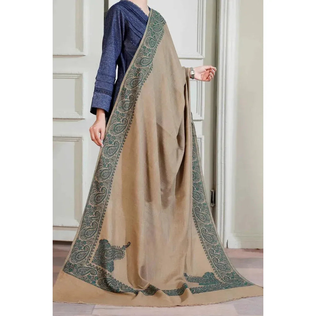 on a model Brown Winter Shawl with Sea Green, Traditional Embroidery Shawl
This camel brown shawl features exquisite sea green embroidery, creating a visually stunning piece. The shawl is available for purchase at Najmadesighns and Co., a reputable online retailer based in the United States.