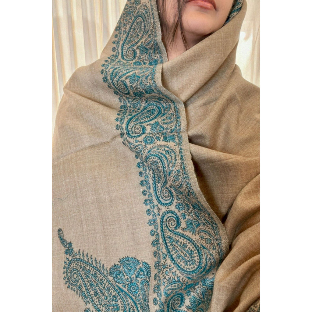 Brown Winter Shawl with Sea Green, Traditional Embroidery Shawl
This camel brown shawl features exquisite sea green embroidery, creating a visually stunning piece. The shawl is available for purchase at Najmadesighns and Co., a reputable online retailer based in the United States.