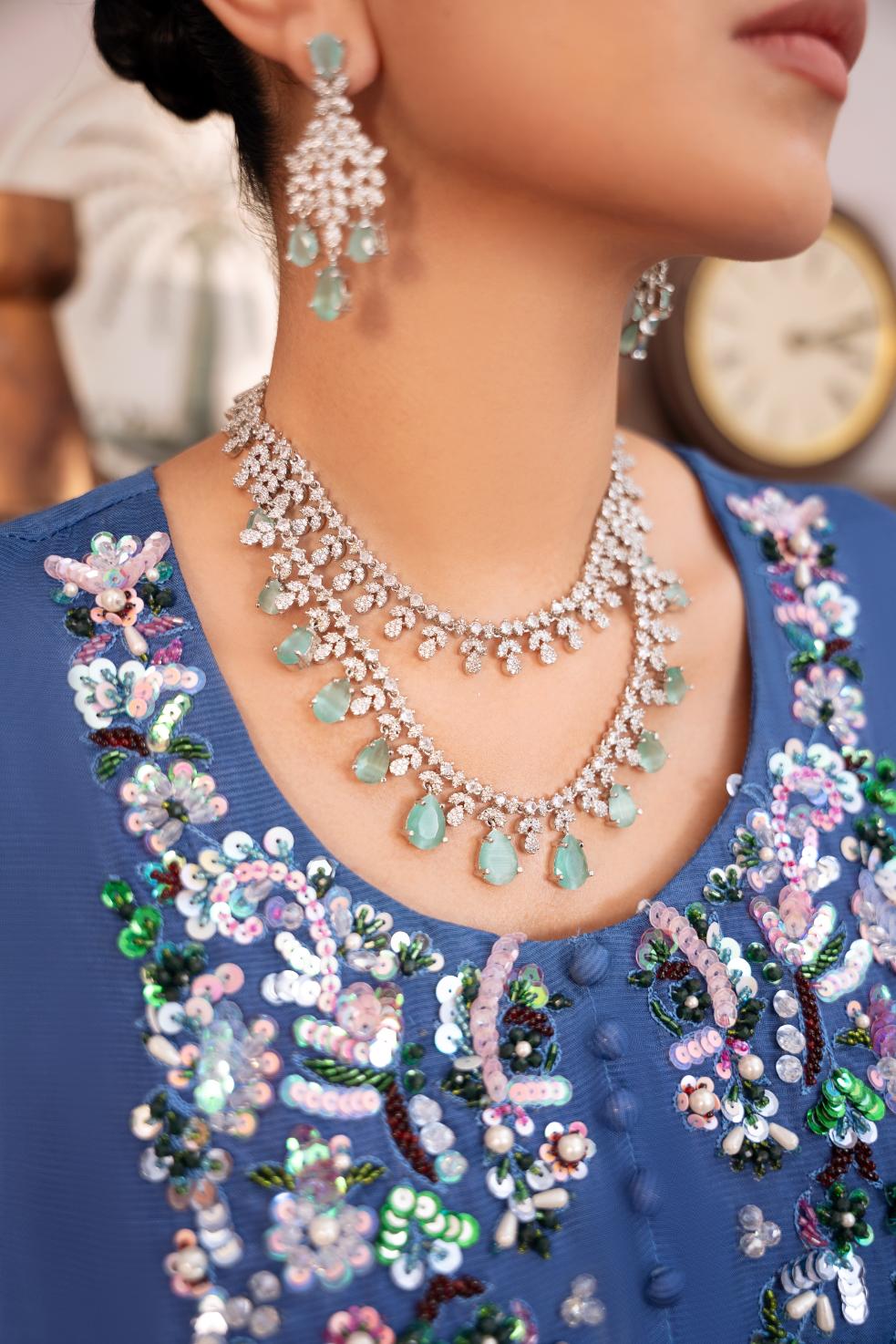 • Clothing: Embroidered/Printed suit for women - Made of best quality fabric - lawn or linen or chiffon - pure silk - Available at Najma Designs & Co. • Jewelry: Gold - plated stud earrings for