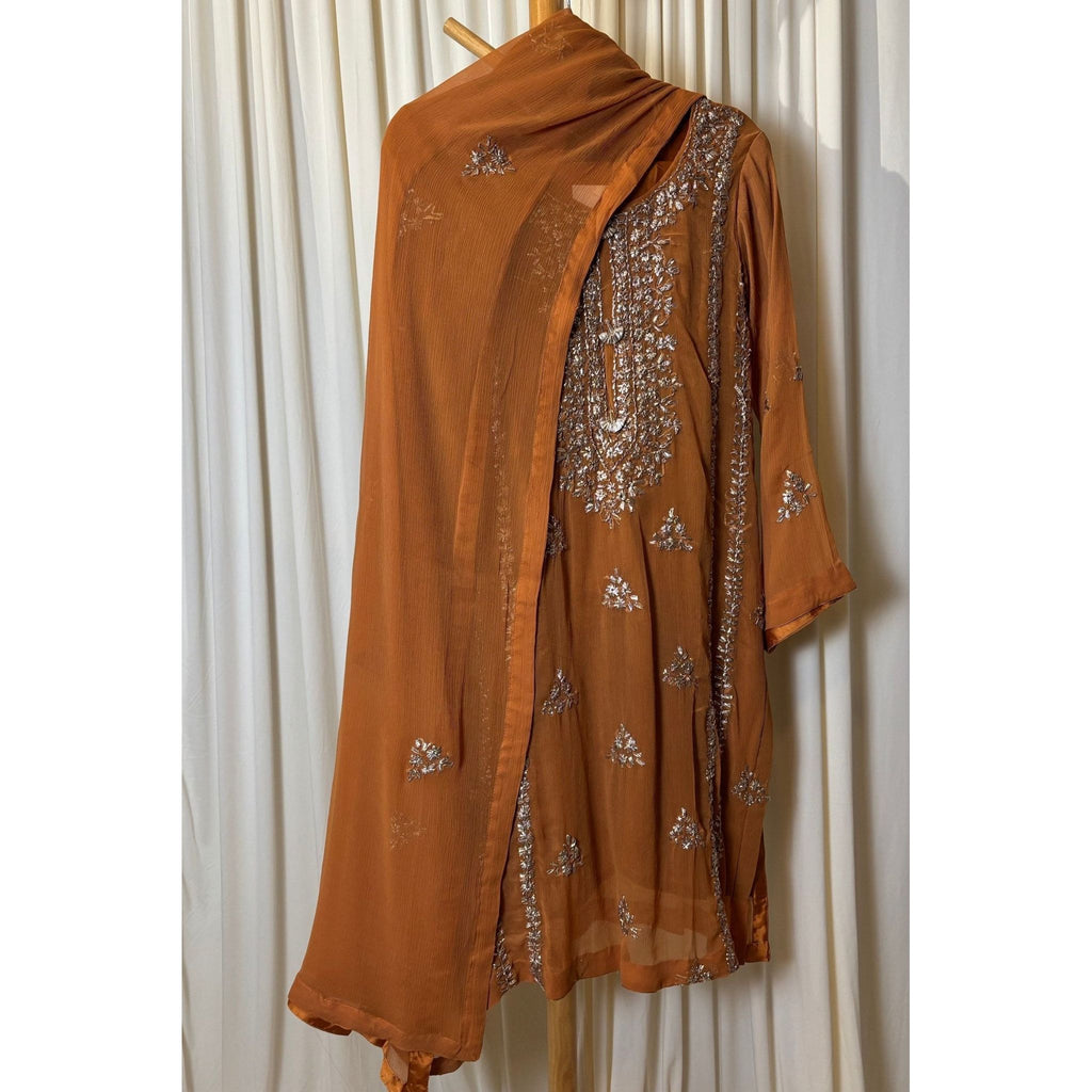 A chiffon fabric burnt orange  outfit with hand embroidery. by Najmadesigns and co. gotta work 