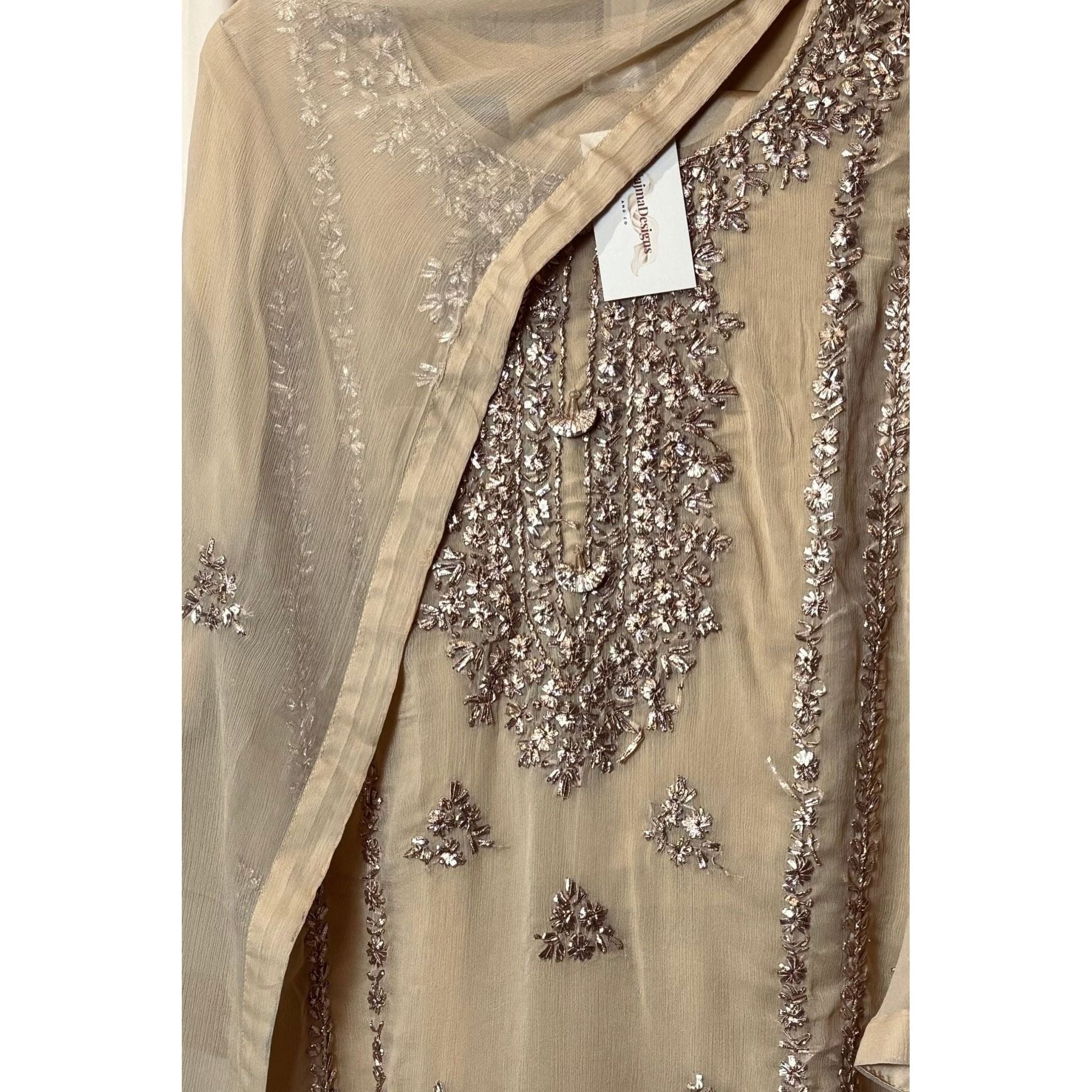 A chiffon fabric off white  outfit with hand embroidery. by Najmadesigns and co. gotta work 