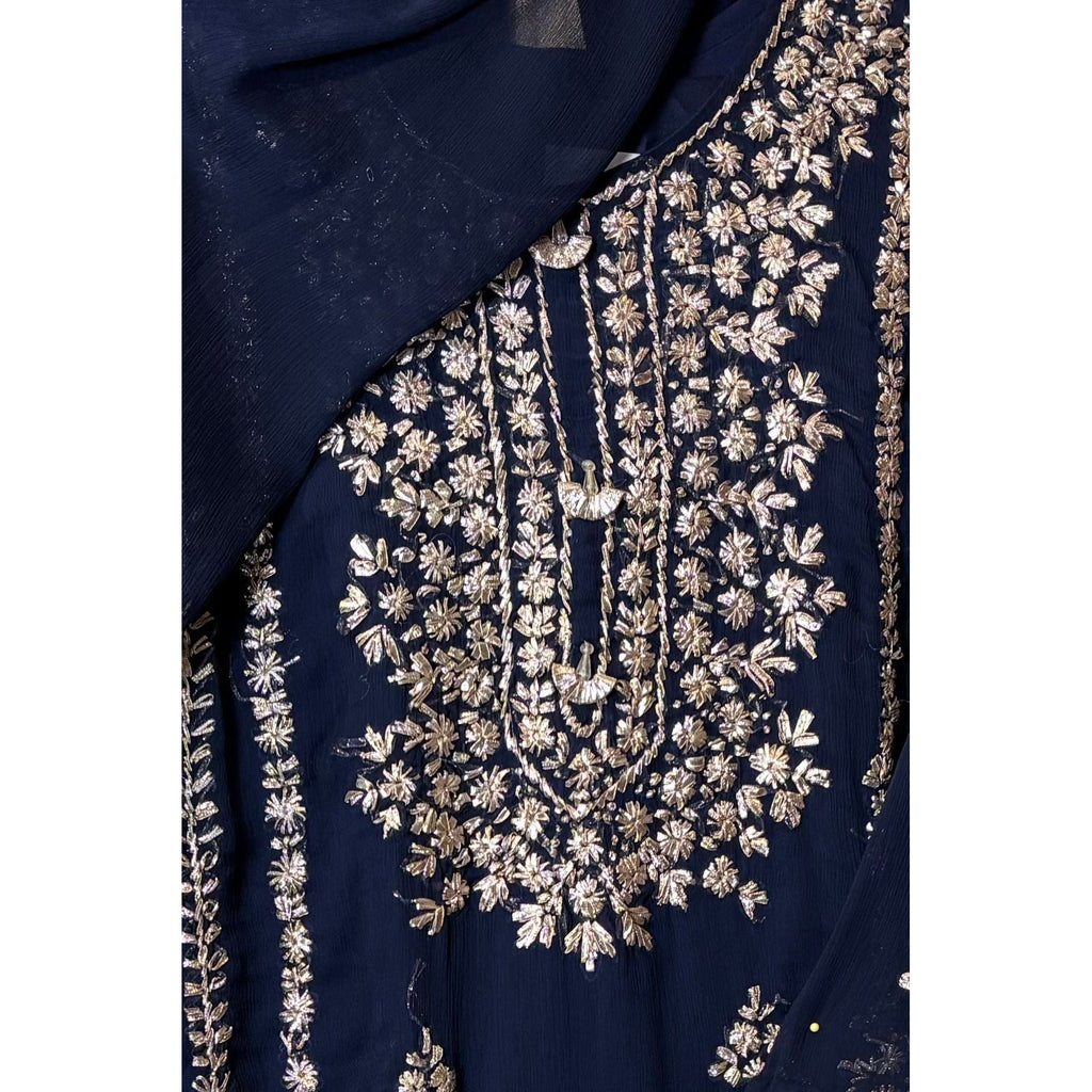 A chiffon fabric navy blue outfit with hand embroidery. by Najmadesigns and co.
