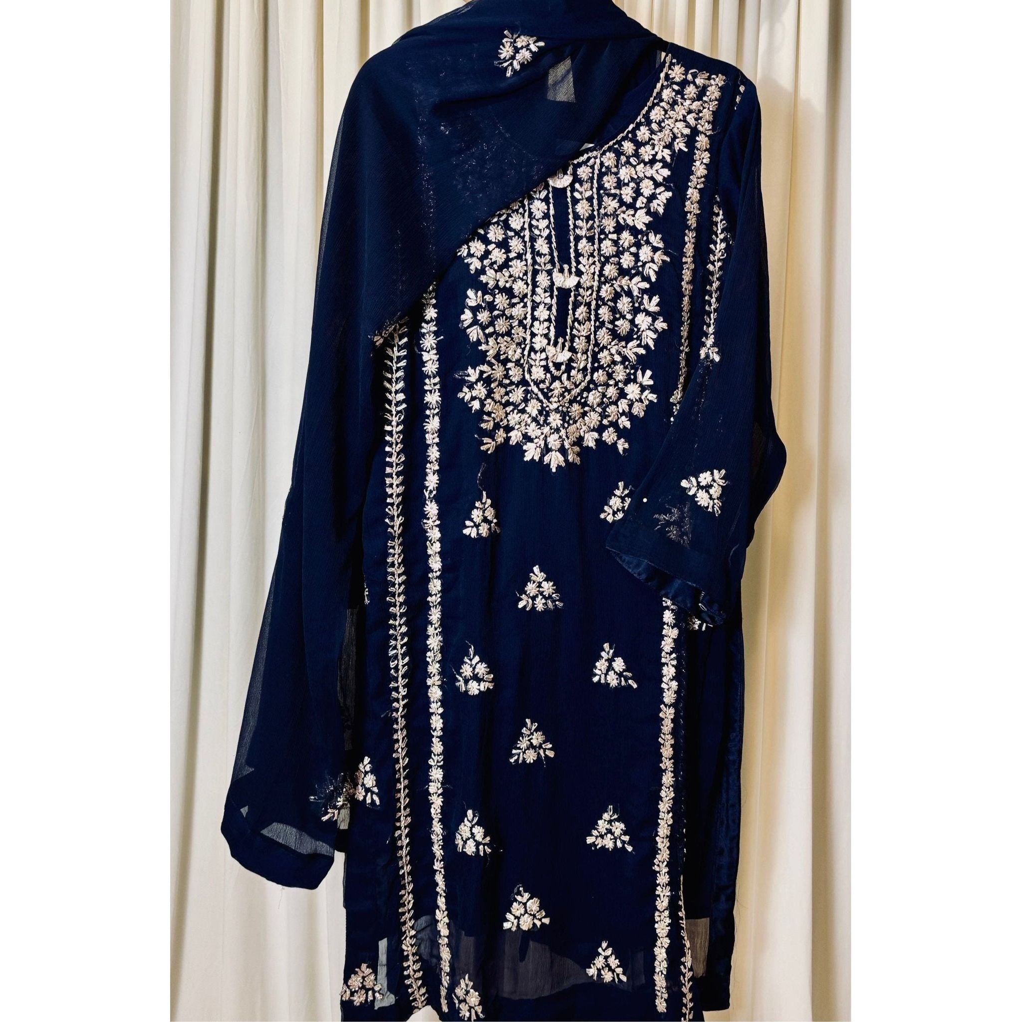 A chiffon fabric blue outfit with hand embroidery. by Najmadesigns and co.