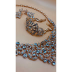 One karat gold plated. This stunning crystal bridal set includes a beautiful bracelet and a stunning, eye-catching necklace. 