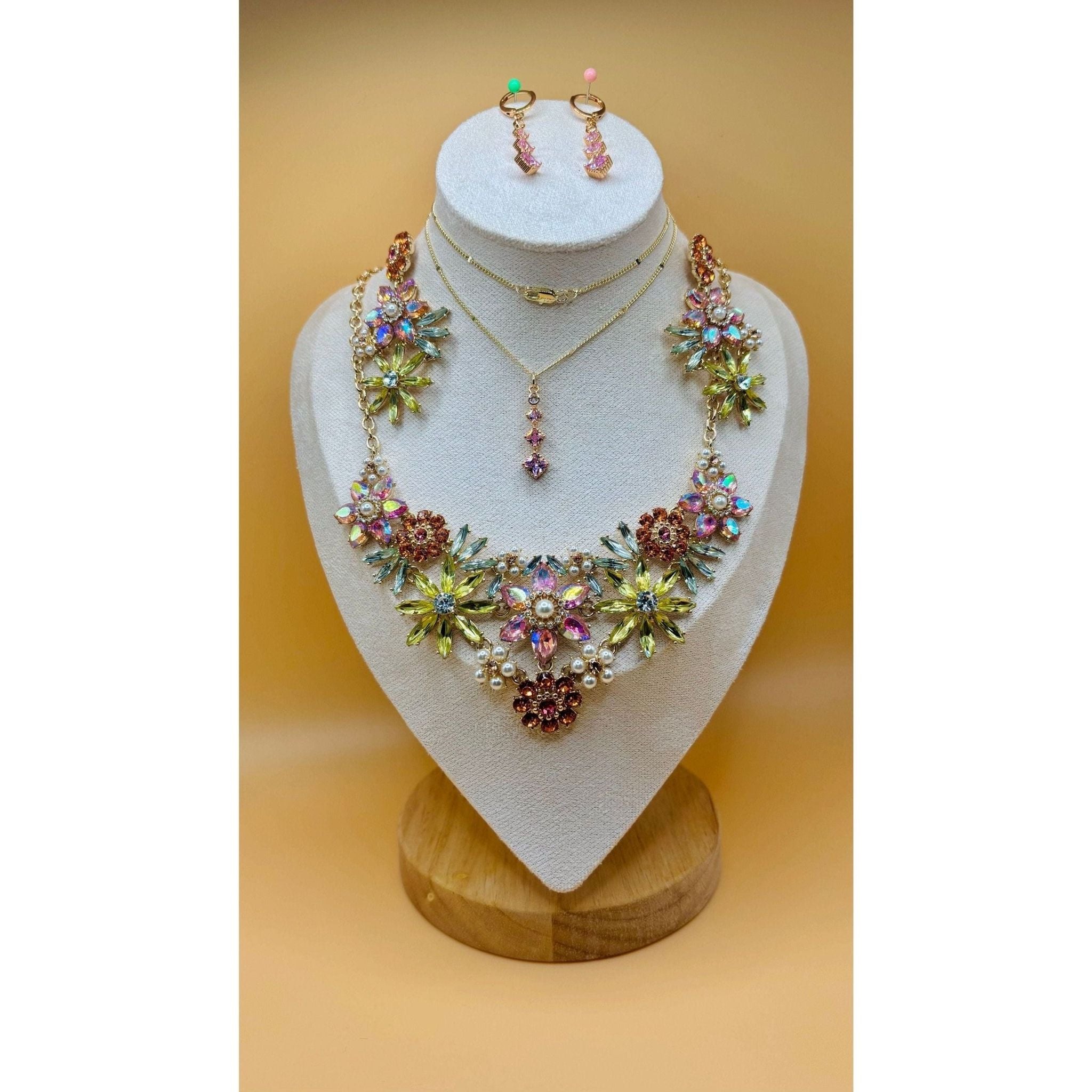 The Crystal Flower Jewel Set boasts an exquisite collection of multi-colored flowers, exuding elegance and sophistication in any ensemble. This exquisite jewelry set is available for purchase in Pakistan and Canada through Najmadesigns and Co. 