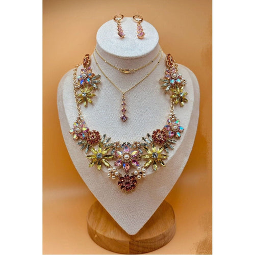 The Crystal Flower Jewel Set boasts an exquisite collection of multi-colored flowers, exuding elegance and sophistication in any ensemble. This exquisite jewelry set is available for purchase in Pakistan and Canada through Najmadesigns and Co. 