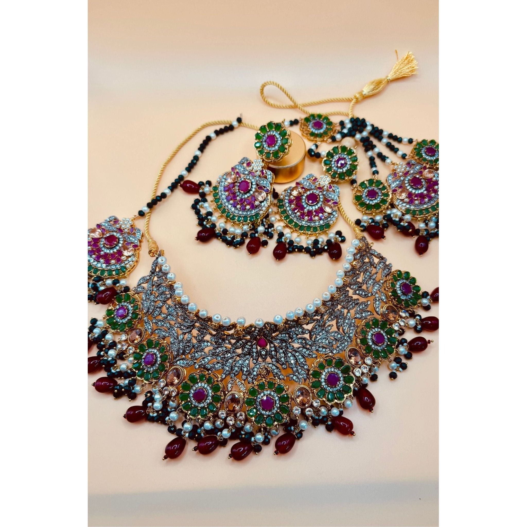 Emerald Bridal Jewelry Set with Tikka, Jhoomer Earrings, and Necklace, Embellished with Emerald, Ruby Stones, Pearl Motis, and Feroza Accents, Gold-Plated Brass, Perfect for Indian and Pakistani Brides, Adds Radiant Grace to Special Occasions, Ready to Ship"