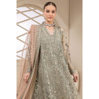 A frock in a vibrant green color, adorned with intricate embroidery, complemented by a dupatta in a peach-colored embroidery. 