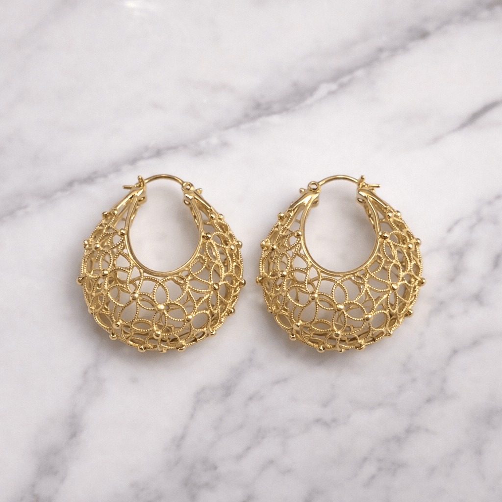 • Clothing: Embroidered/Printed suit for women - Made of best quality fabric - lawn or linen or chiffon- pure silk - Available at Najma Designs & Co. • Jewelry: Gold-plated stud earrings for