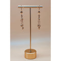 These golden dangling earrings are made with the best quality 1-carat gold plated, ensuring both beauty and durability.
