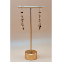 These golden dangling earrings are made with the best quality 1-carat gold plated, ensuring both beauty and durability.