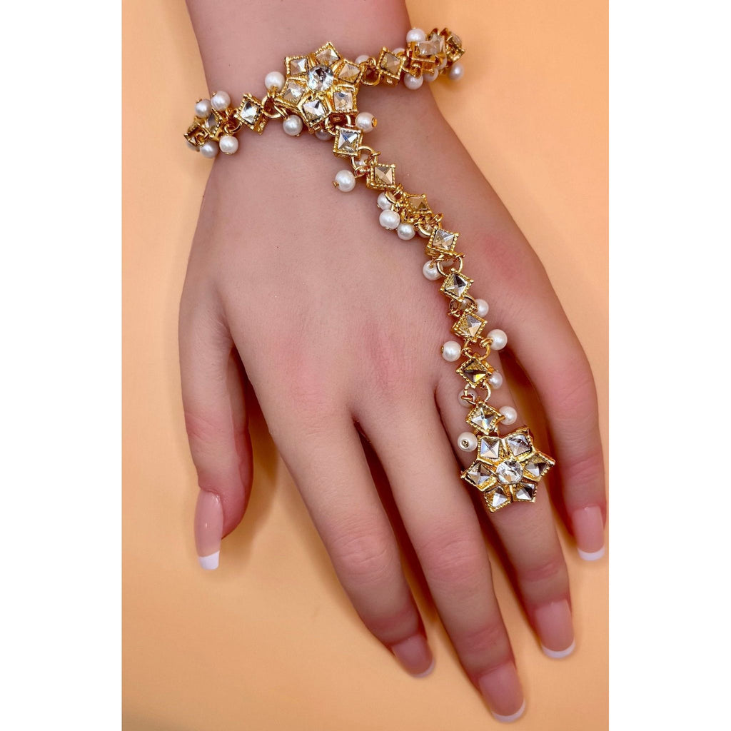 Crafted from top-quality materials, this hand bracelet with ring is an elegant and high-quality accessory. Perfect for adding a touch of sophistication to any outfit, this bracelet is sure to catch the eye with its flawless design and excellent craftsmanship. Elevate your style with this must-have piece.&nbsp;
