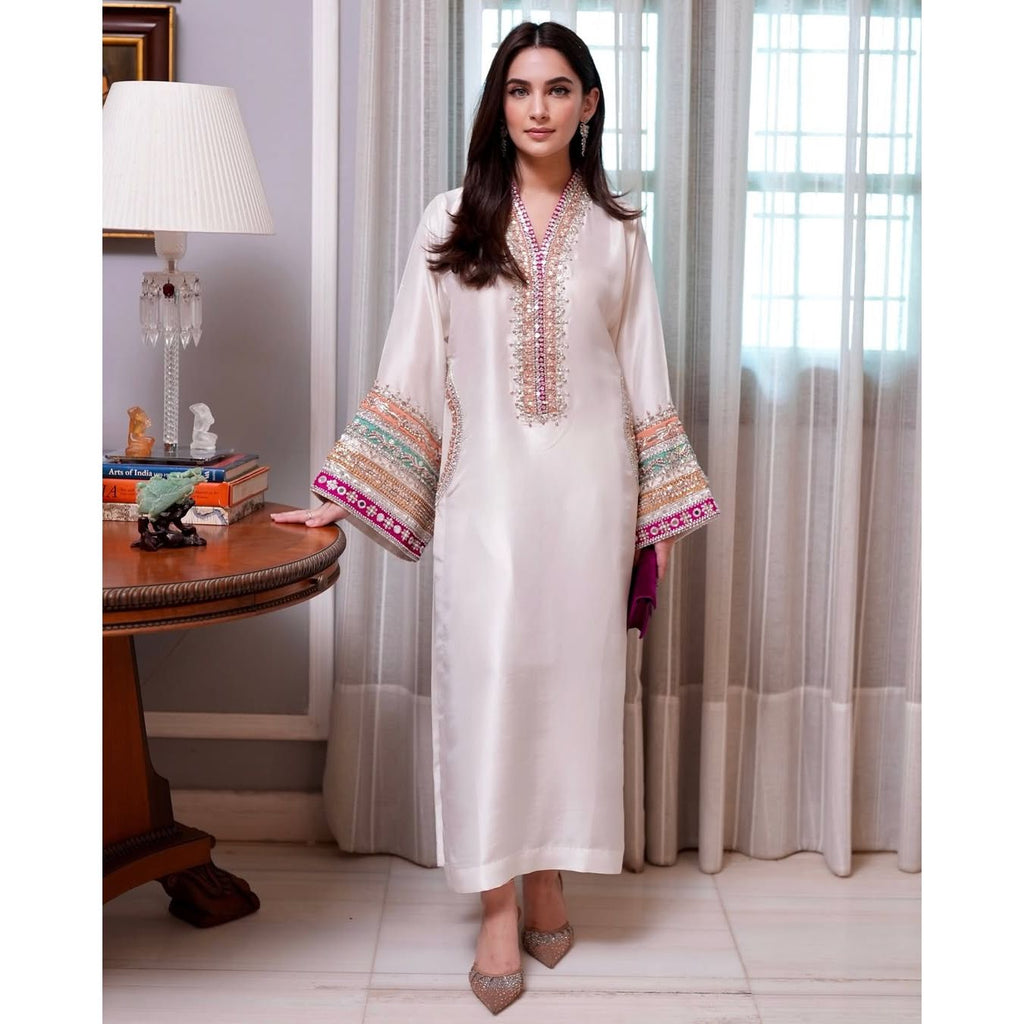 • Clothing: Embroidered/Printed suit for women - Made of best quality fabric - lawn or linen or chiffon - pure silk - Available at Najma Designs & Co. • Jewelry: Gold - plated stud earrings for