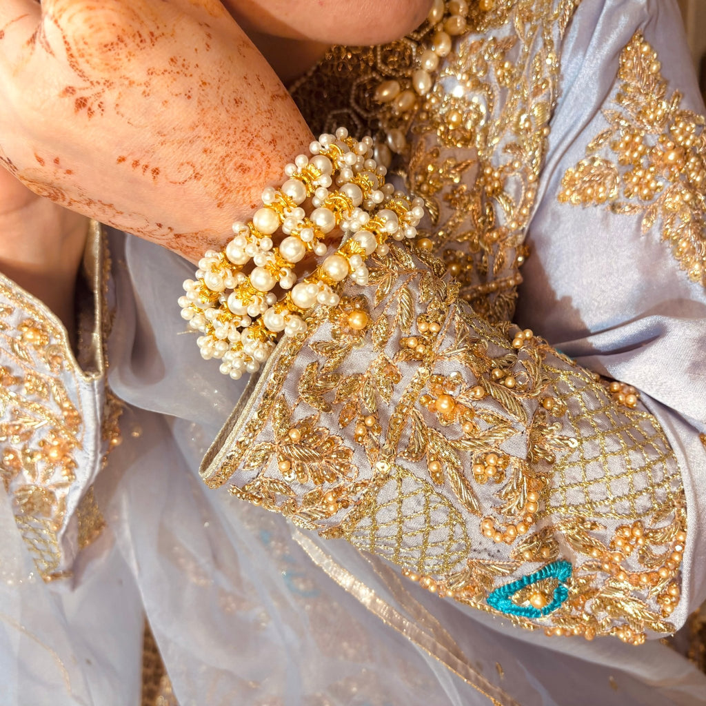 • Clothing: Embroidered/Printed suit for women - Made of best quality fabric - lawn or linen or chiffon - pure silk - Available at Najma Designs & Co. • Jewelry: Gold - plated stud earrings for