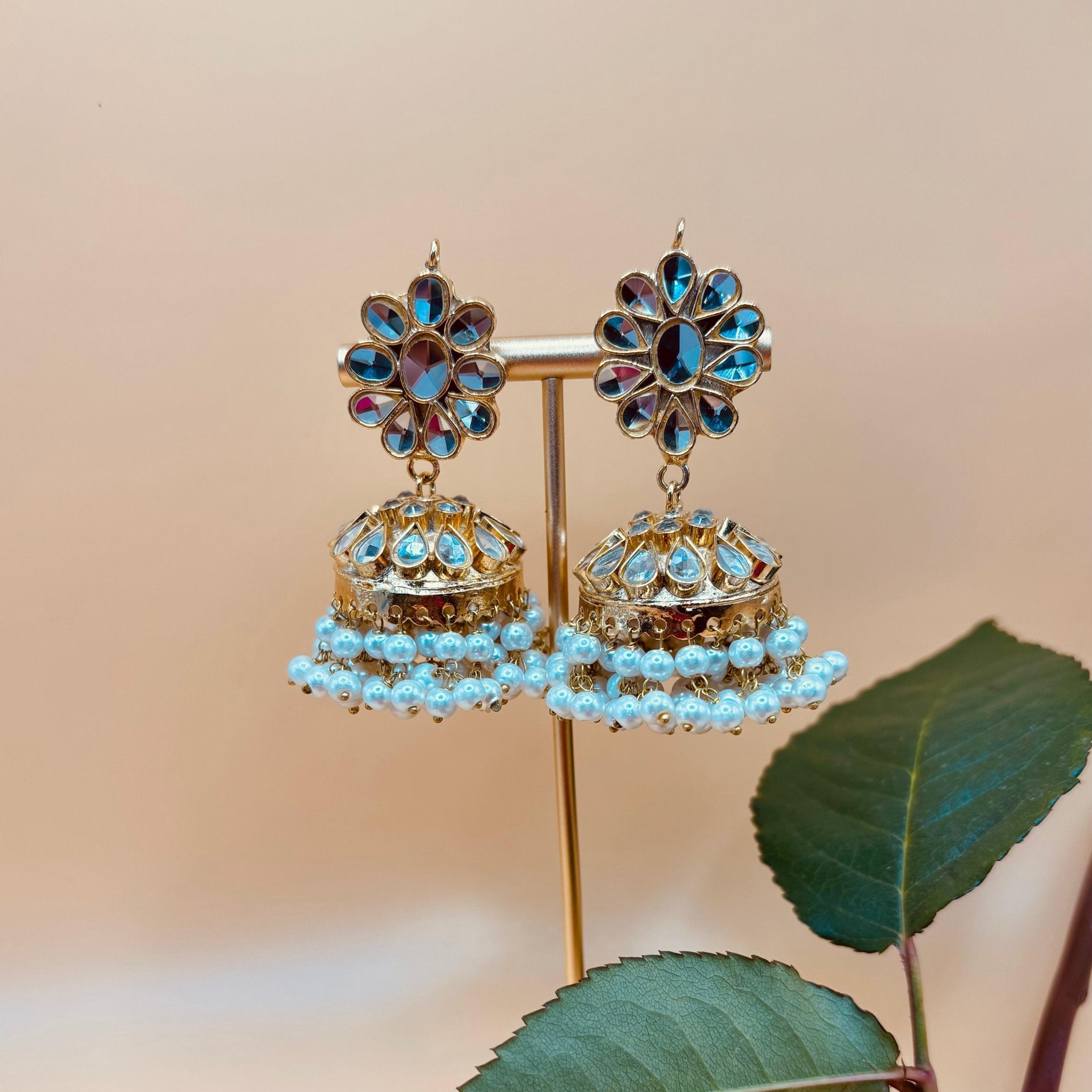 • Clothing: Embroidered/Printed suit for women - Made of best quality fabric - lawn or linen or chiffon - pure silk - Available at Najma Designs & Co. • Jewelry: Gold - plated stud earrings for