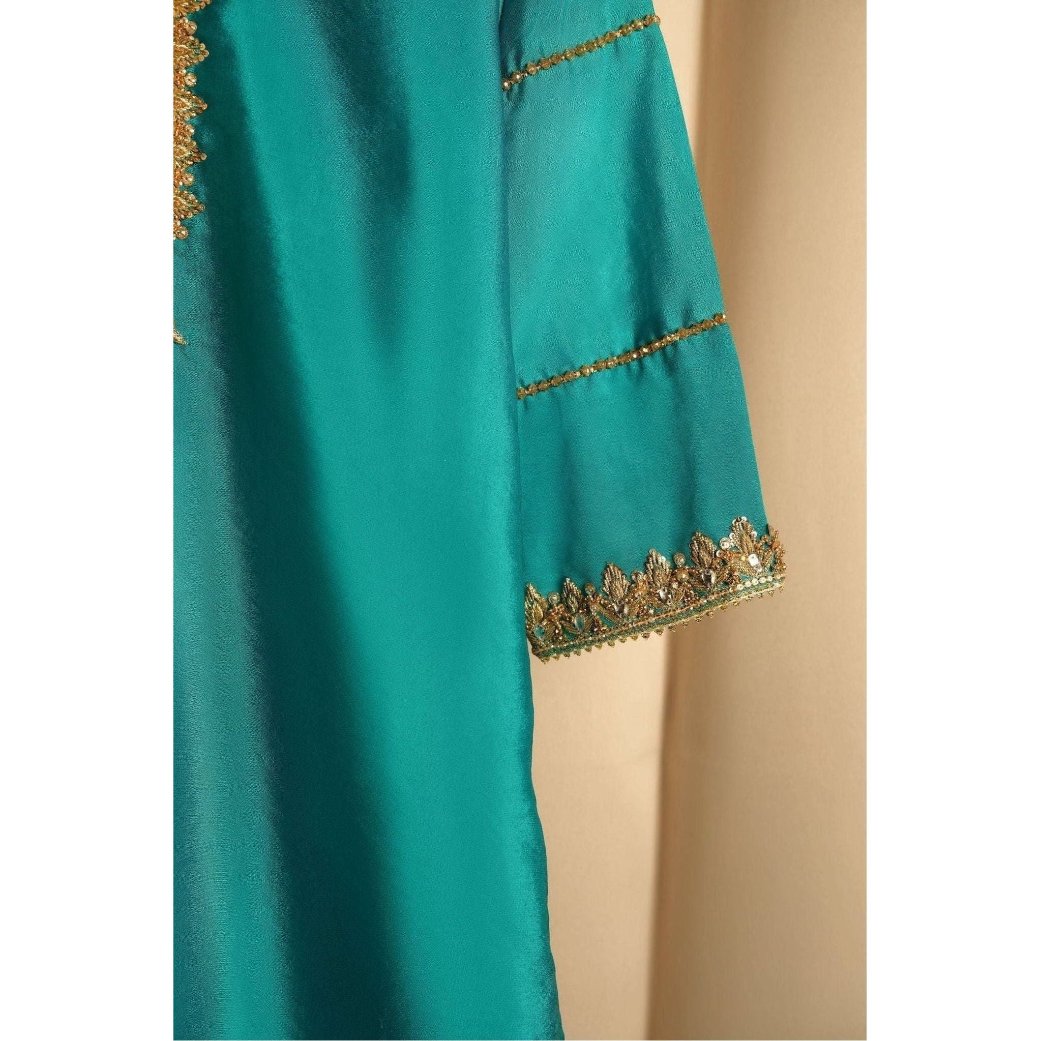 close up  of Sea green gharara set with beautiful gold embroidery, shirt 
