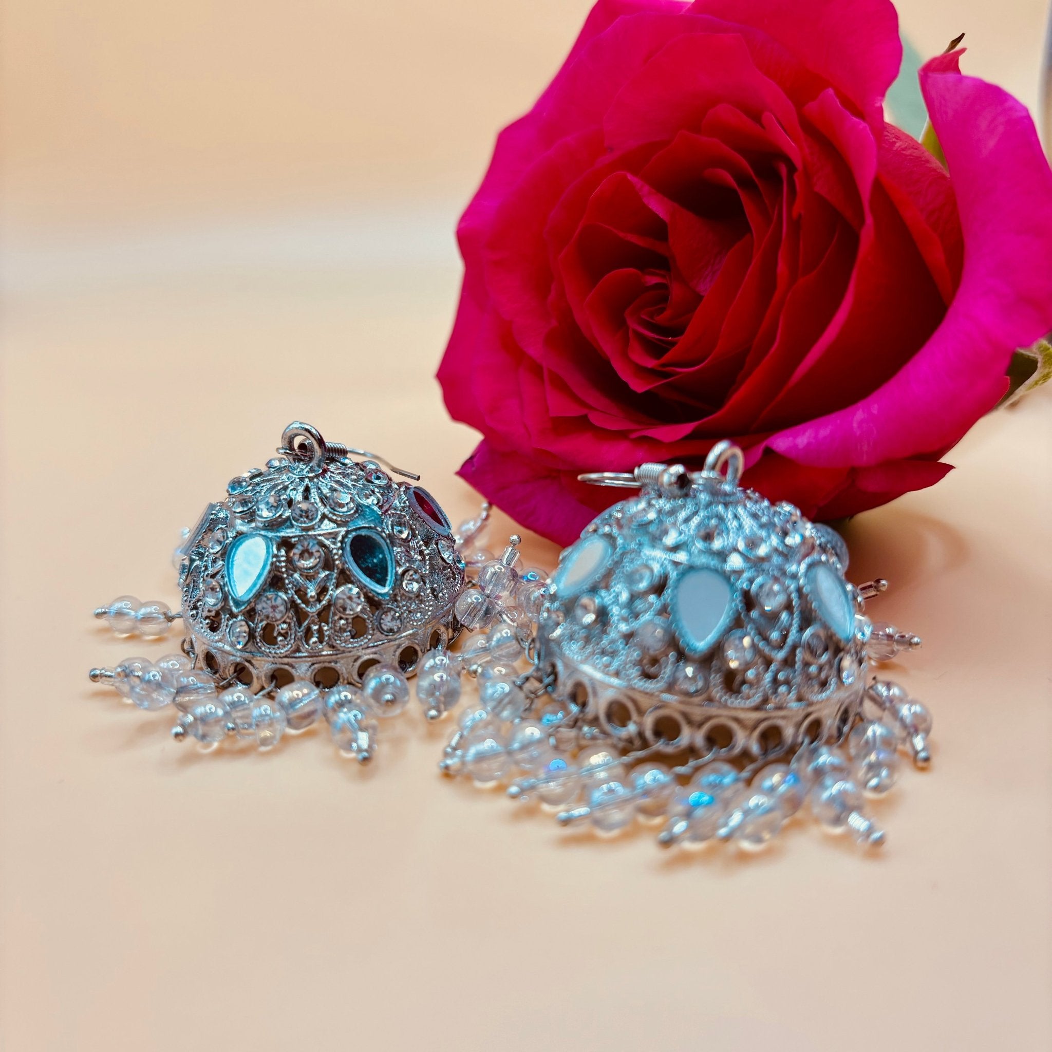 • Clothing: Embroidered/Printed suit for women - Made of best quality fabric - lawn or linen or chiffon - pure silk - Available at Najma Designs & Co. • Jewelry: Gold - plated stud earrings for