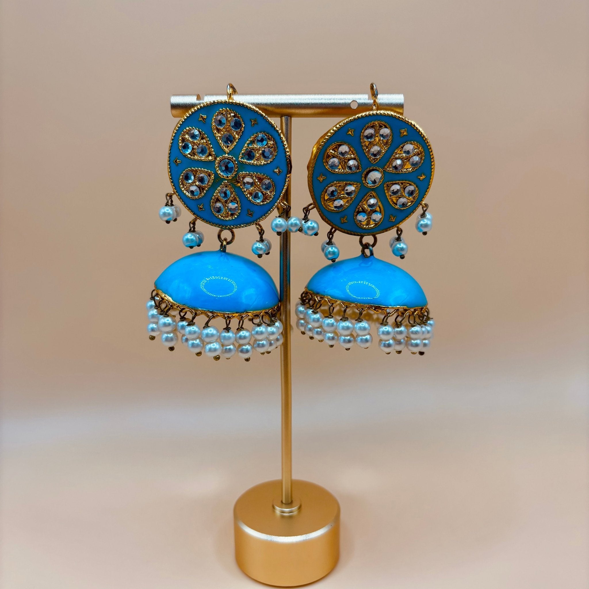 • Clothing: Embroidered/Printed suit for women - Made of best quality fabric - lawn or linen or chiffon - pure silk - Available at Najma Designs & Co. • Jewelry: Gold - plated stud earrings for