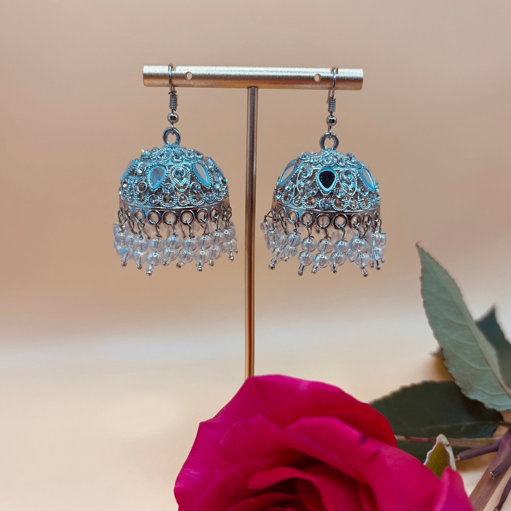 • Clothing: Embroidered/Printed suit for women - Made of best quality fabric - lawn or linen or chiffon - pure silk - Available at Najma Designs & Co. • Jewelry: Gold - plated stud earrings for