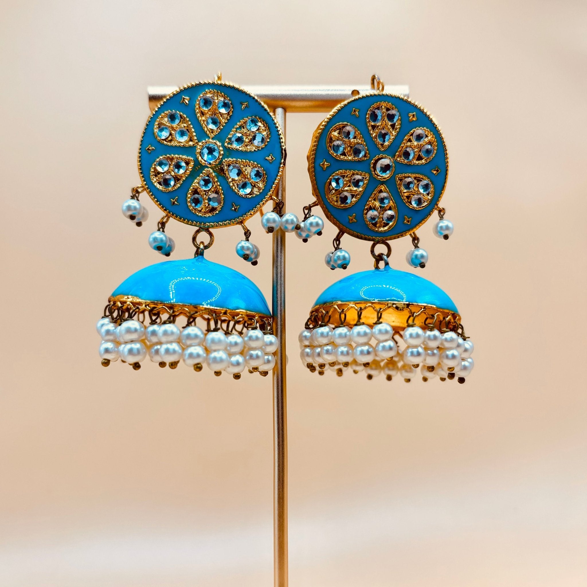 • Clothing: Embroidered/Printed suit for women - Made of best quality fabric - lawn or linen or chiffon - pure silk - Available at Najma Designs & Co. • Jewelry: Gold - plated stud earrings for