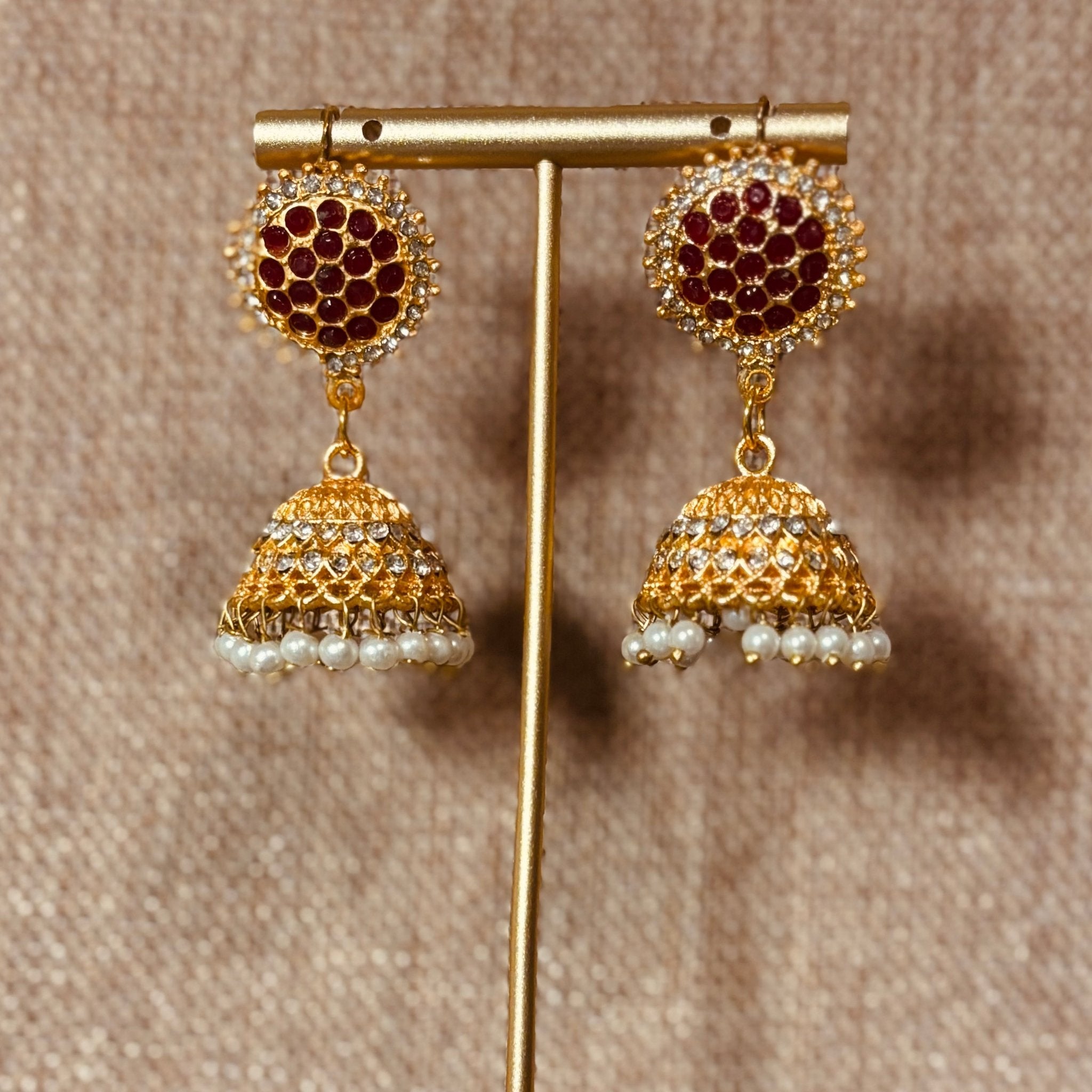 • Clothing: Embroidered/Printed suit for women - Made of best quality fabric - lawn or linen or chiffon - pure silk - Available at Najma Designs & Co. • Jewelry: Gold - plated stud earrings for