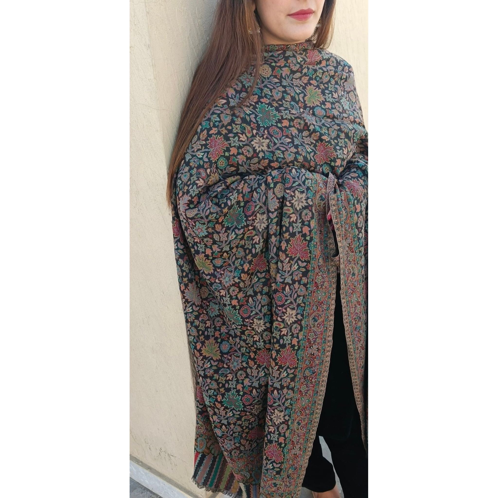 Expertly crafted in Pakistan, the Kani Shawl Pashmina from Najma designs and co is a one-of-a-kind piece that exudes luxury. The muted red hue pairs beautifully with the multicolor hand woven design, providing both warmth and style. Elevate any outfit with this exquisite pashmina.