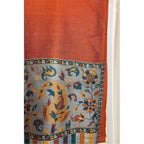 A lightweight, exquisite Shawl woven from Kani yarn in burnt orange hues. The Shawl features a pure silk Pashmina base and a delicate grey border. 