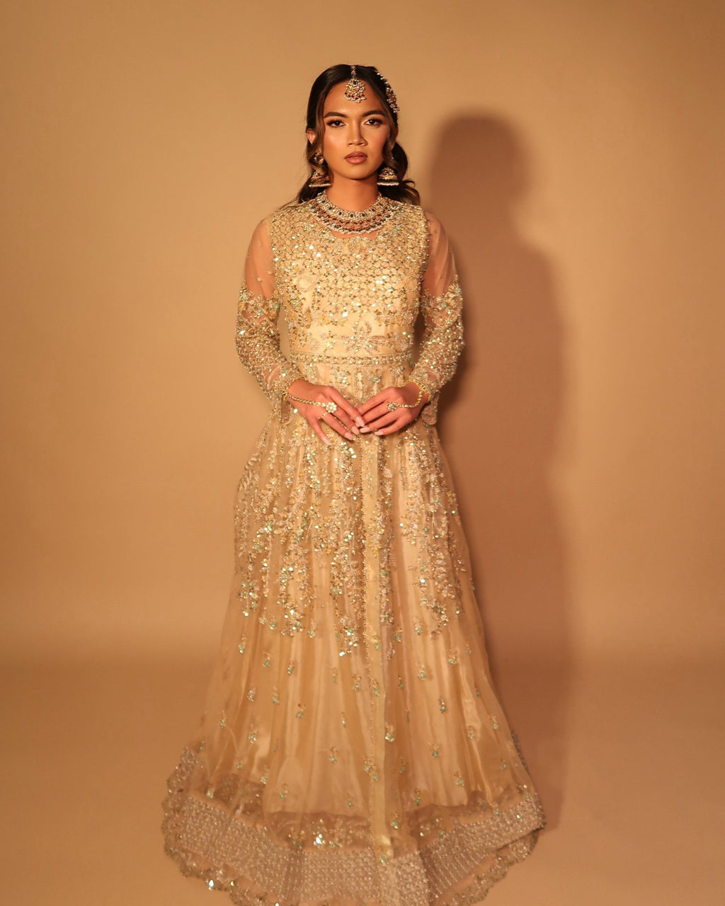 • Clothing: Embroidered/Printed suit for women - Made of best quality fabric - lawn or linen or chiffon- pure silk - Available at Najma Designs & Co. • Jewelry: Gold-plated stud earrings for