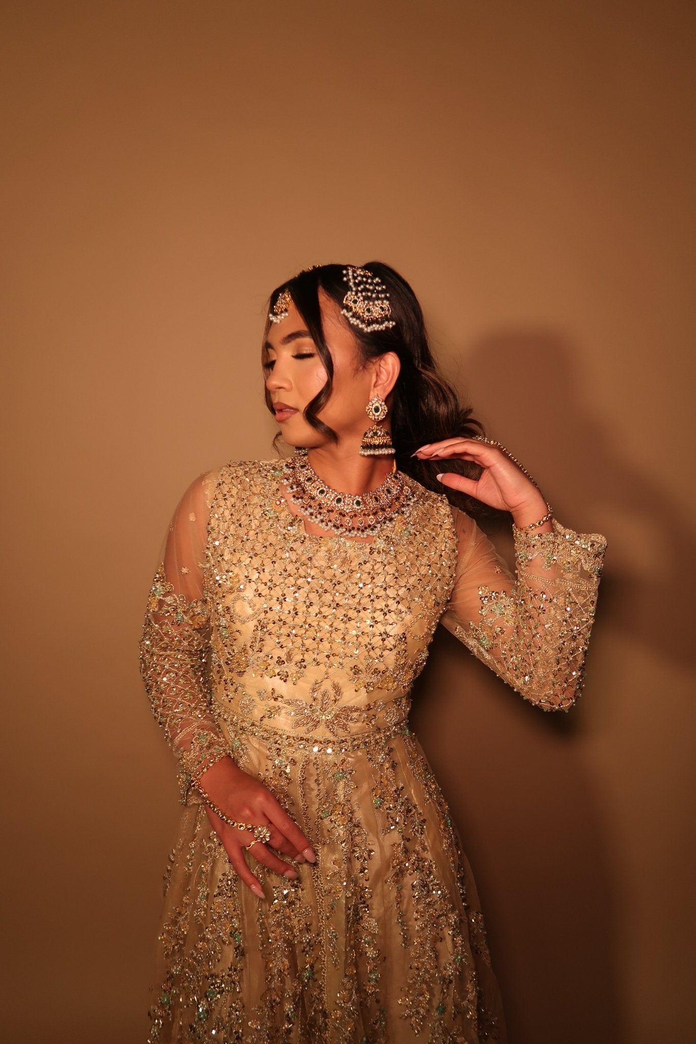 • Clothing: Embroidered/Printed suit for women - Made of best quality fabric - lawn or linen or chiffon- pure silk - Available at Najma Designs & Co. • Jewelry: Gold-plated stud earrings for