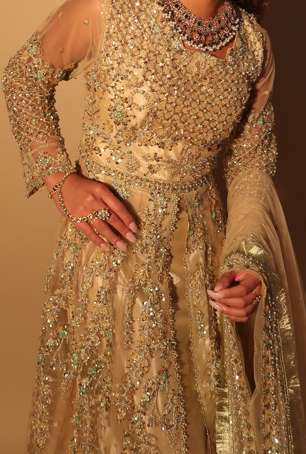• Clothing: Embroidered/Printed suit for women - Made of best quality fabric - lawn or linen or chiffon- pure silk - Available at Najma Designs & Co. • Jewelry: Gold-plated stud earrings for