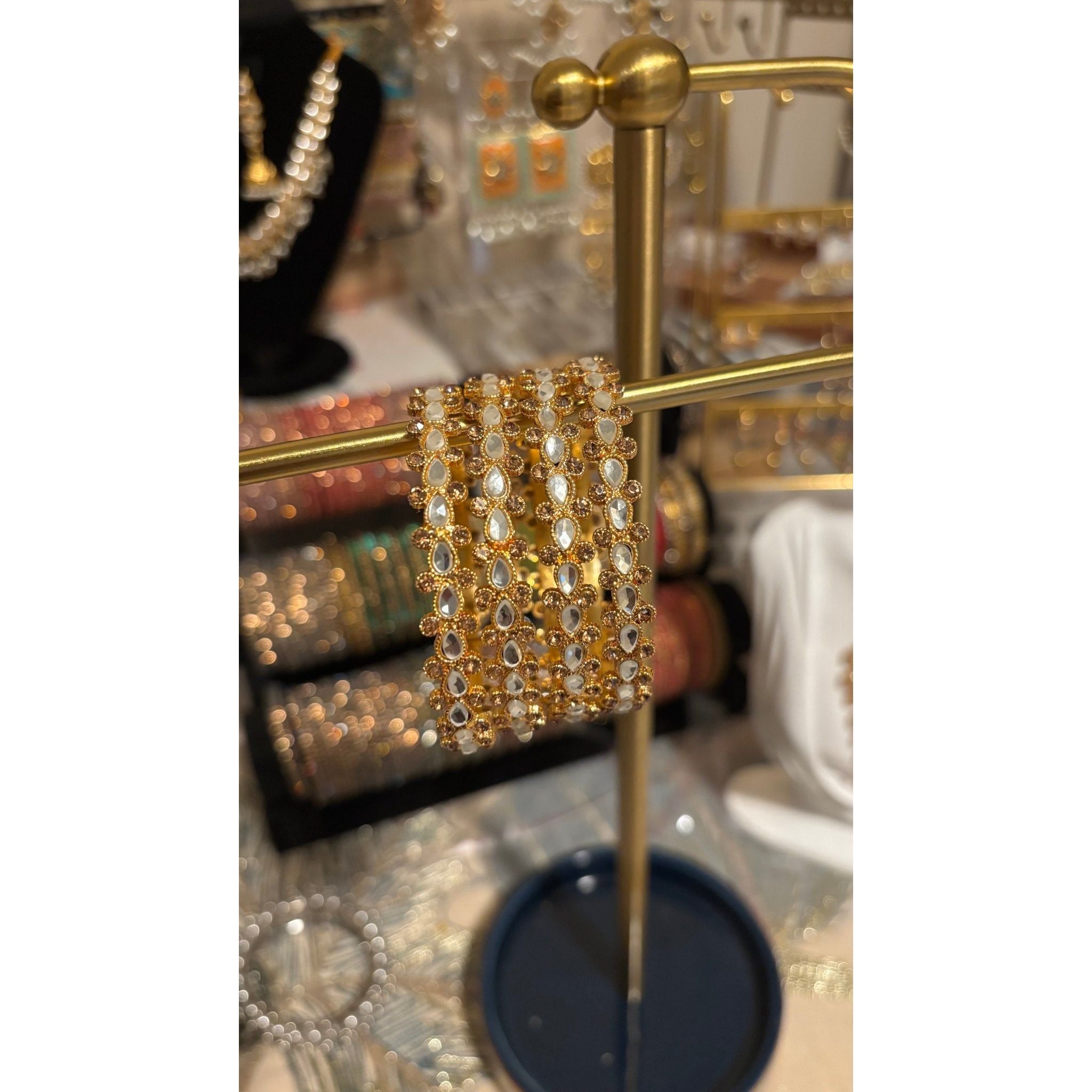 • Clothing: Embroidered/Printed suit for women - Made of best quality fabric - lawn or linen or chiffon - pure silk - Available at Najma Designs & Co. • Jewelry: Gold - plated stud earrings for