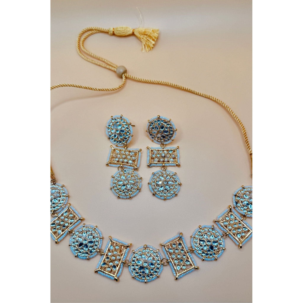 This antique jewelry piece includes earrings and a necklace. 