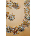This antique jewelry piece includes earrings and a necklace. 