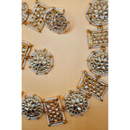 This antique jewelry piece includes earrings and a necklace. 